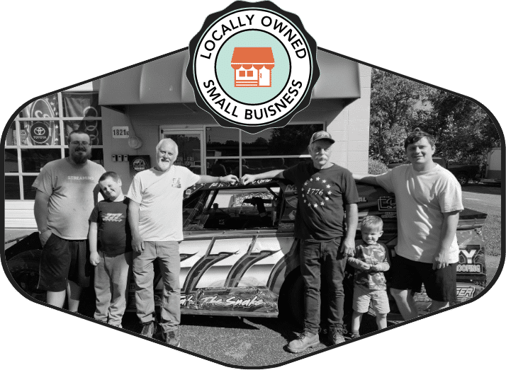 The McConnell family and team outside the Raleigh auto glass shop